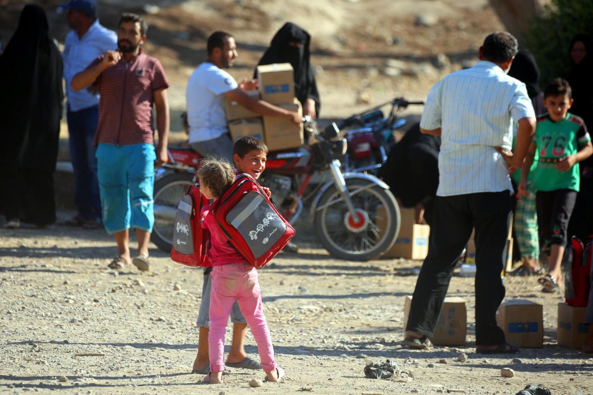 Un neno nunha rúa de Siria