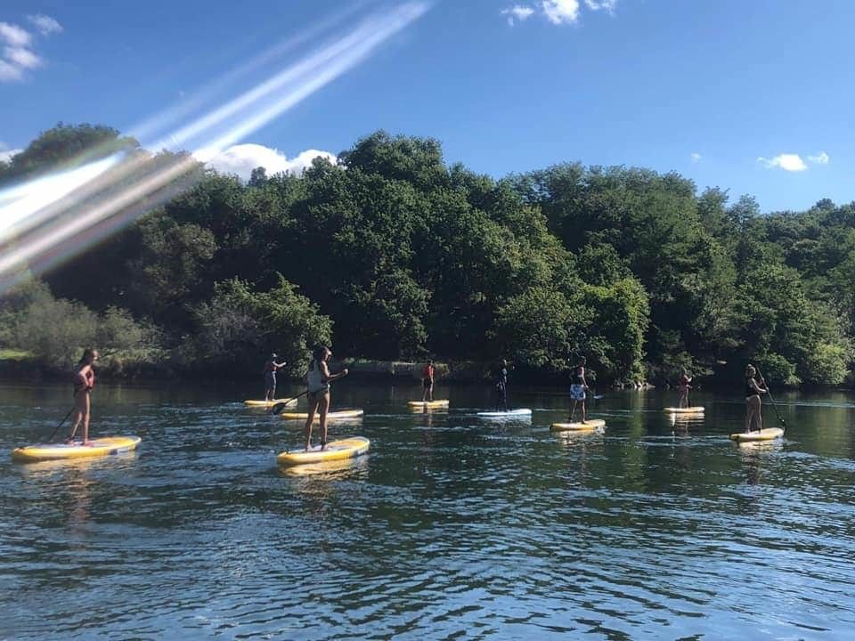 Participantes en las rutas de paddle surf por el río Lérez
