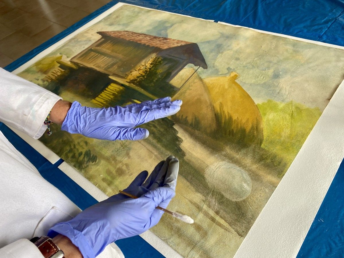 Restauración da acuarela do pintor Manuel Torres en que aparece un hórreo