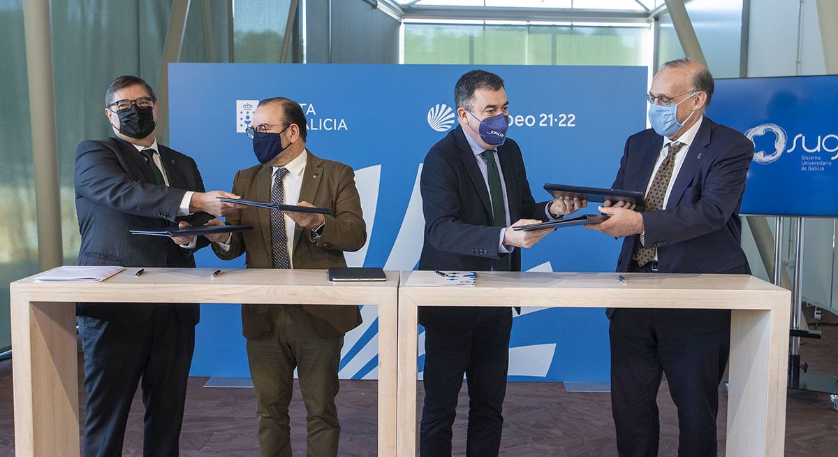 Román Rodríguez, cos tres reitores das universidades galegas