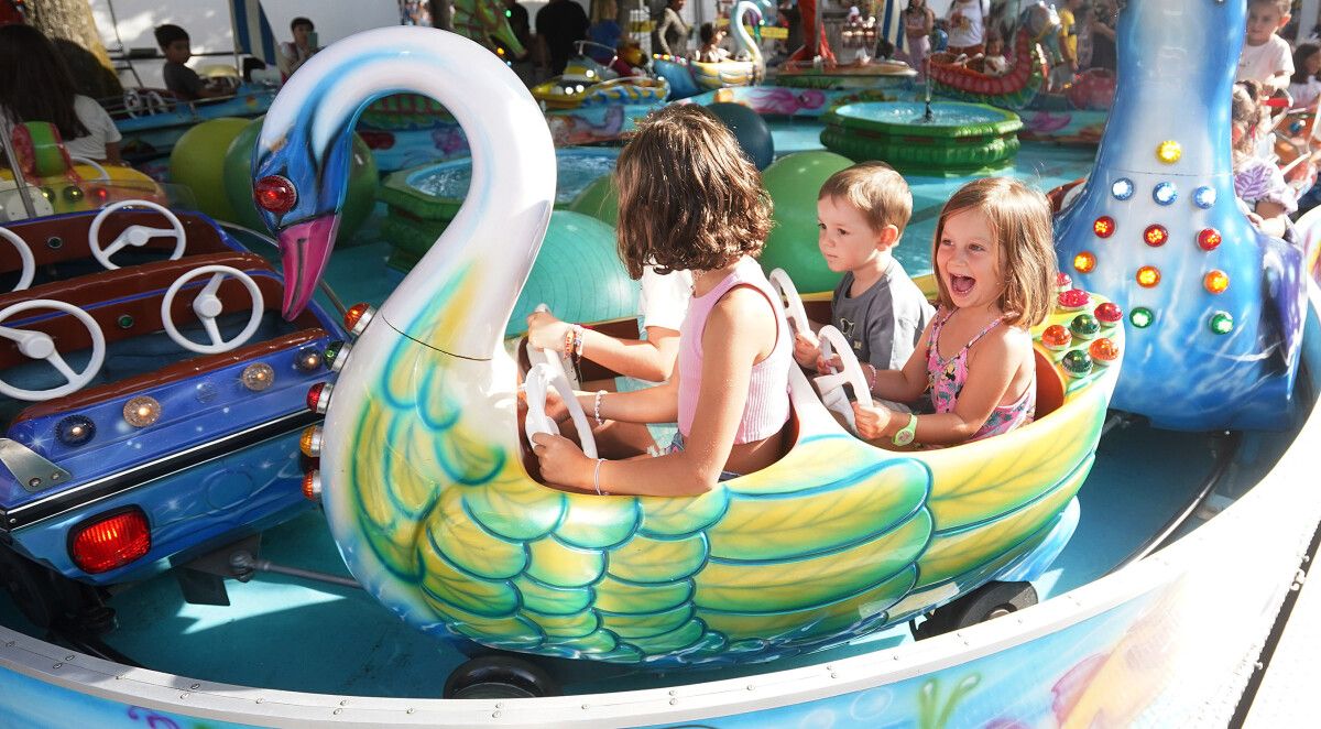 Día del niño en las atracciones de las fiestas de la Peregrina