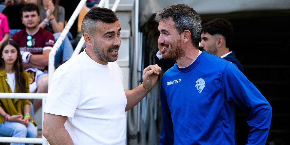 Yago Iglesias e Rubén Domínguez, no partido de liga entre Pontevedra e Ourense CF en Pasarón
