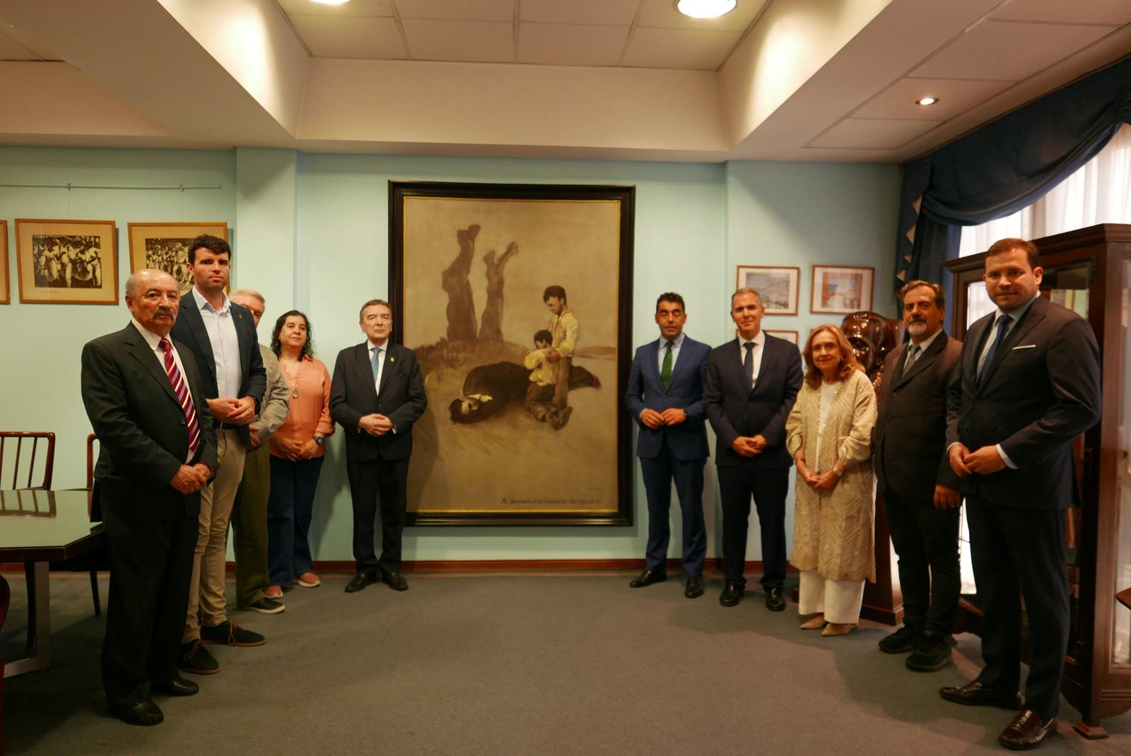 Representantes de la Deputación, Museo de Pontevedra y Centro Galicia de Buenos Aires posan con el cuadro ´A derradeira leición do mestre´